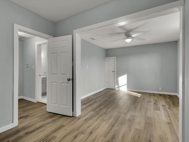 unfurnished room featuring light hardwood / wood-style floors and ceiling fan