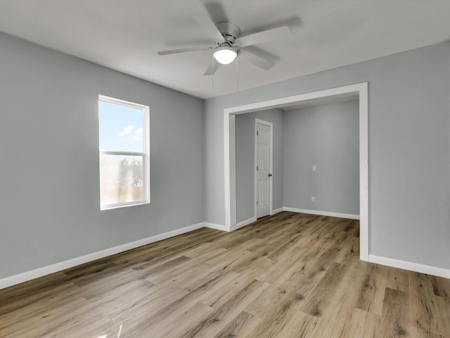 unfurnished bedroom with light hardwood / wood-style flooring and ceiling fan