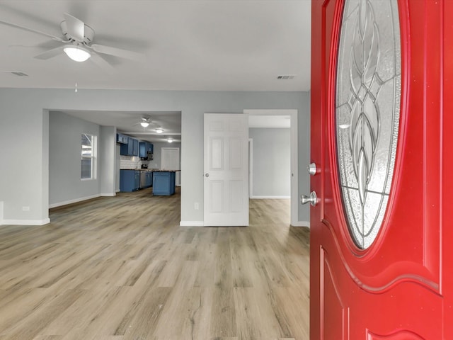 entryway featuring ceiling fan and light hardwood / wood-style flooring