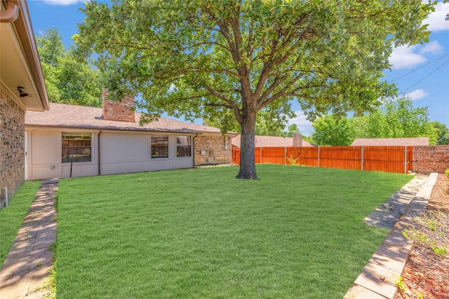 view of yard with fence