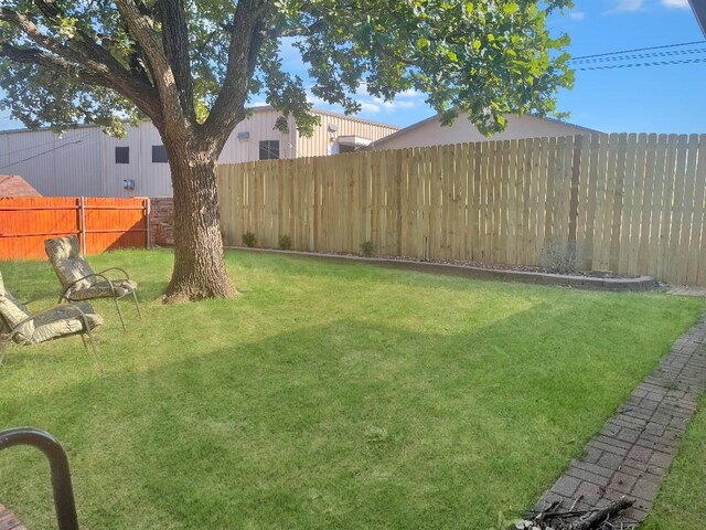 view of front of property with a garage and central AC