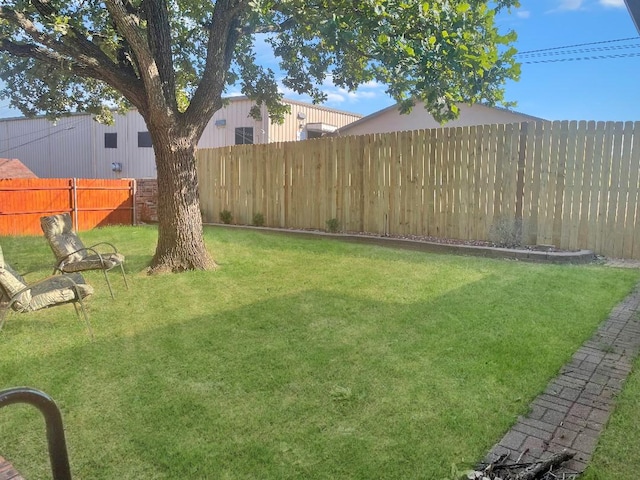 view of yard with a fenced backyard