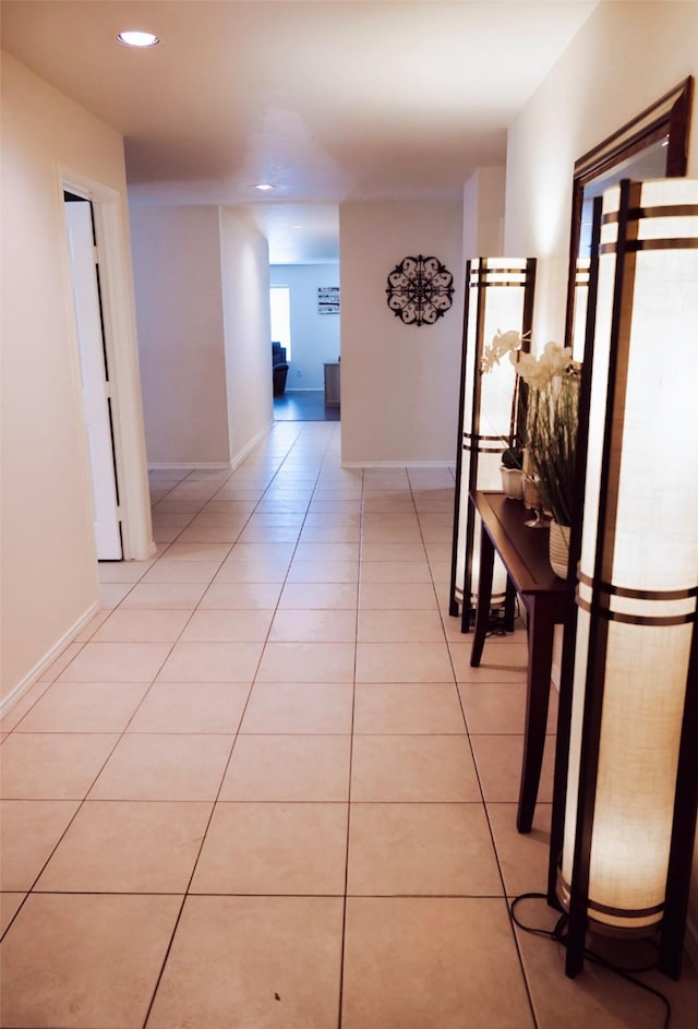 hallway featuring light tile patterned floors