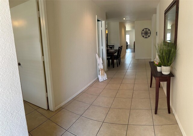 bedroom with ceiling fan and light tile patterned floors