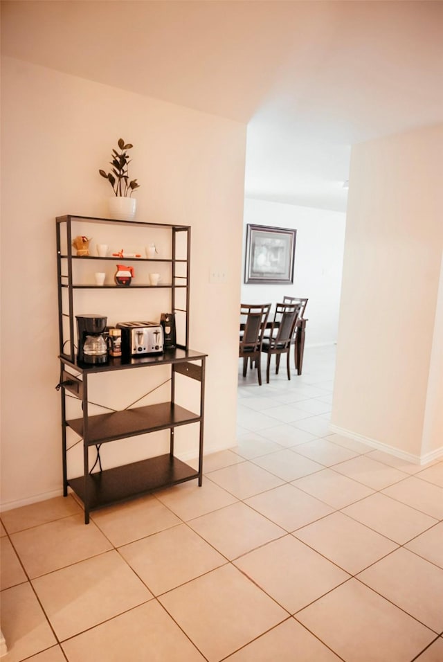 hallway with light tile patterned floors