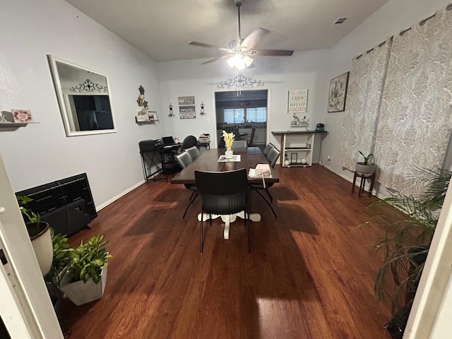 dining area featuring wood-type flooring and ceiling fan