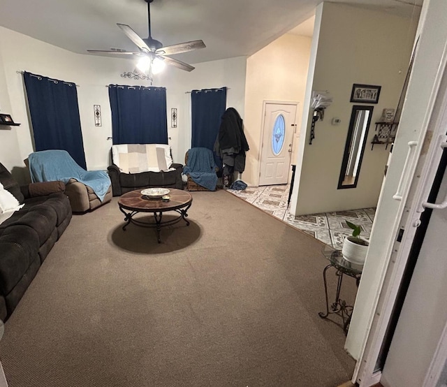 carpeted living room with ceiling fan