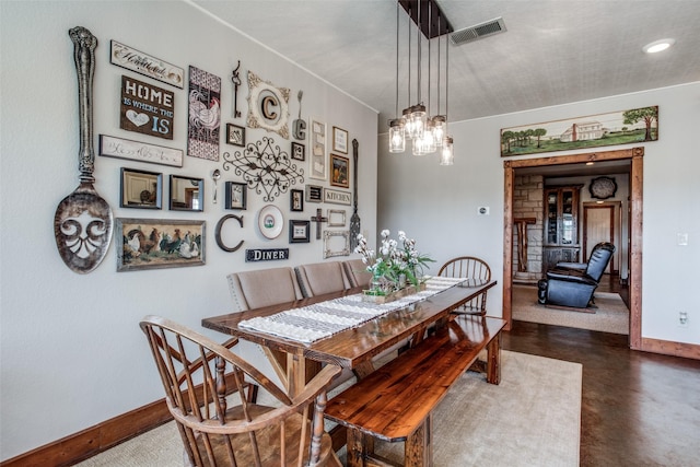 dining space featuring an inviting chandelier