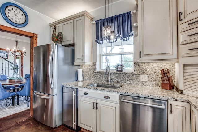 kitchen with wine cooler, sink, pendant lighting, stainless steel appliances, and decorative backsplash