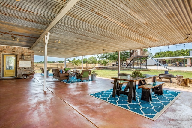 view of patio / terrace featuring an outdoor living space and a playground