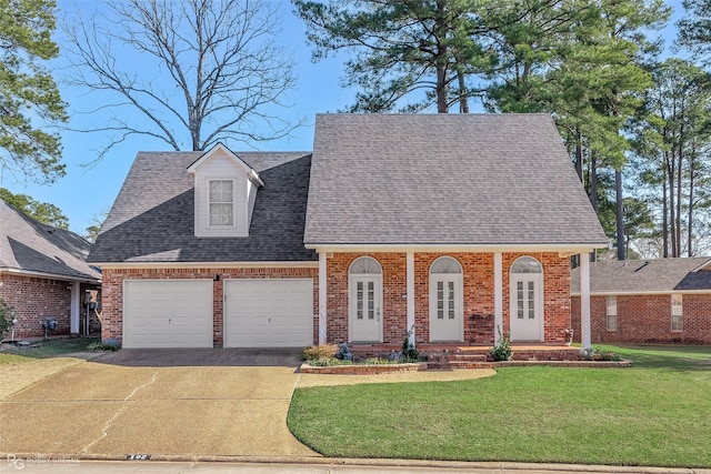 102 Hanging Moss Dr, Benton, LA 71006 - view of front facade featuring a shingled roof, driveway, a front lawn, and brick siding