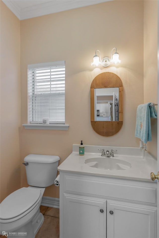 bathroom featuring crown molding, vanity, toilet, and tile patterned flooring