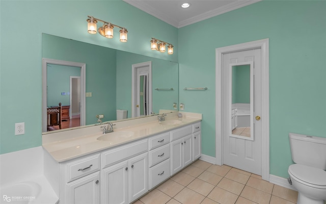 bathroom featuring vanity, ornamental molding, tile patterned floors, and toilet