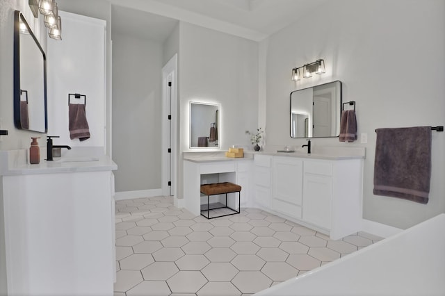 bathroom with vanity and a washtub