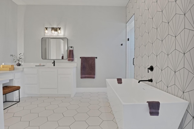 bathroom with shower with separate bathtub, vanity, and tile patterned floors