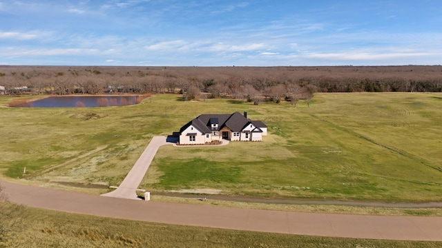 birds eye view of property with a water view and a rural view