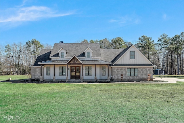 view of front of house with french doors and a front lawn