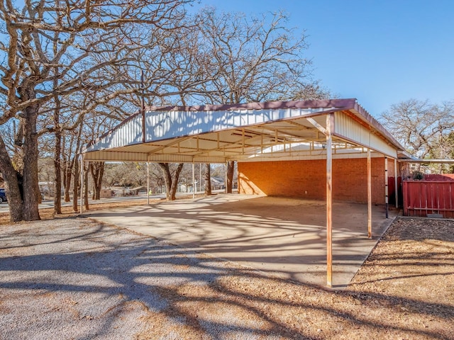 view of vehicle parking featuring a carport