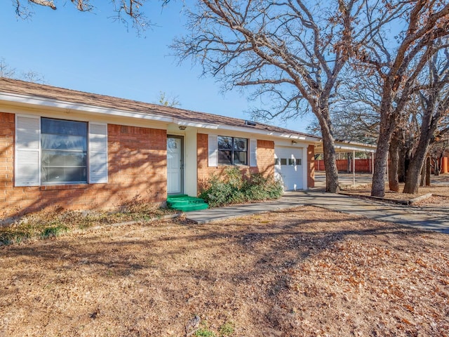 ranch-style house featuring a garage