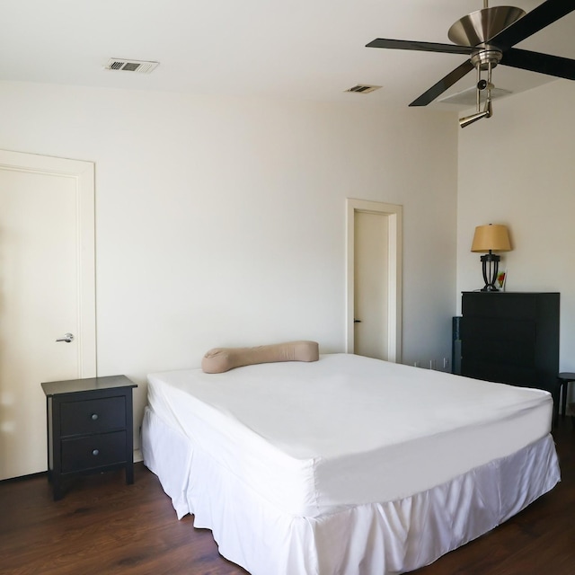 bedroom with dark wood-type flooring and ceiling fan