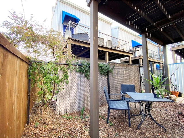 view of patio / terrace featuring outdoor dining space and fence