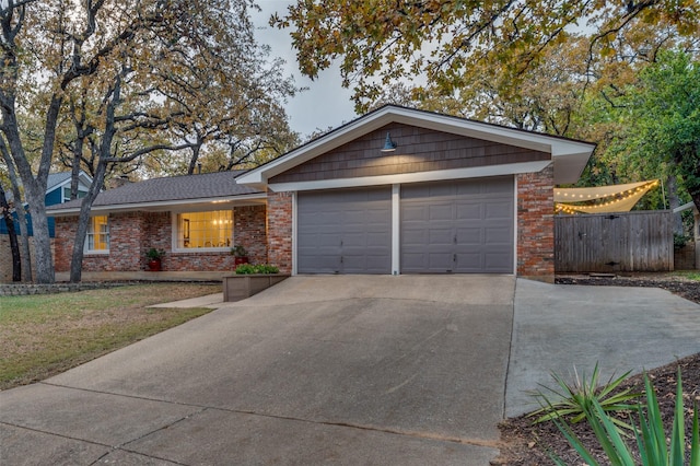 ranch-style home featuring a garage