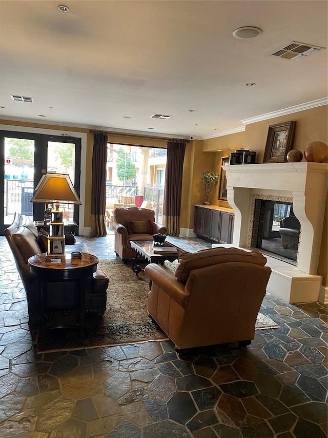 living room with a multi sided fireplace and crown molding