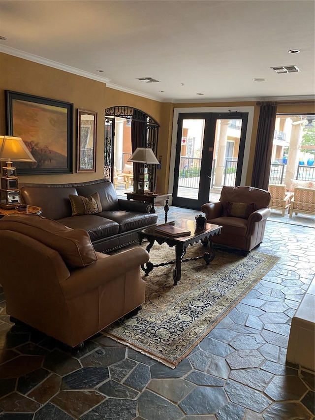 living room featuring ornamental molding and french doors