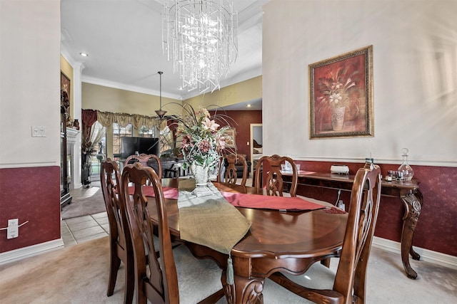 dining space with crown molding, light carpet, and a chandelier