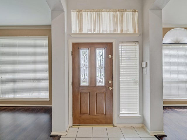 entryway with light tile patterned floors