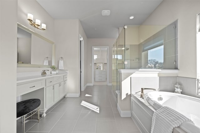 bathroom featuring tile patterned floors, plus walk in shower, and vanity