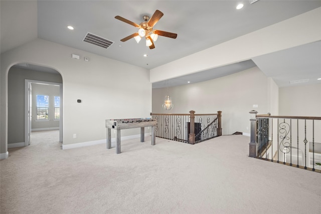 rec room featuring vaulted ceiling, carpet flooring, and ceiling fan