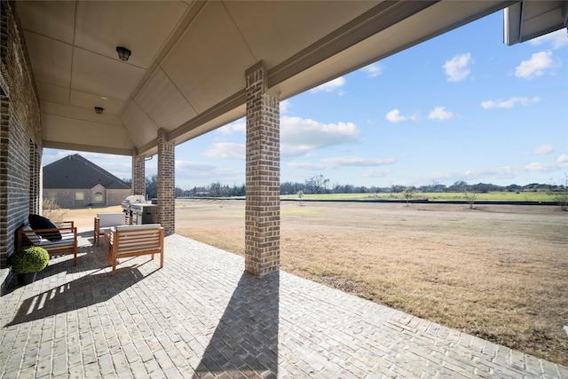 view of patio with a rural view