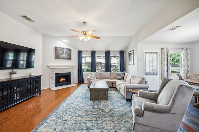 living room with vaulted ceiling, dark hardwood / wood-style floors, and ceiling fan