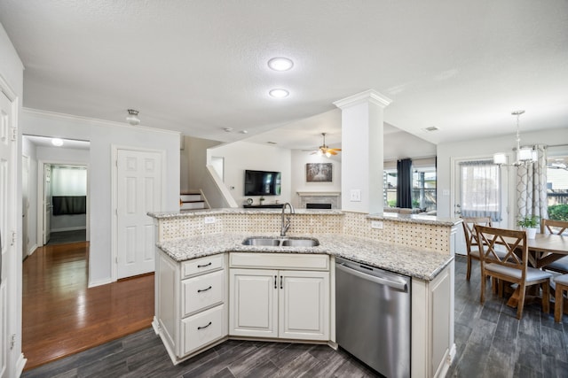 kitchen with dark wood-type flooring, sink, dishwasher, light stone countertops, and white cabinets