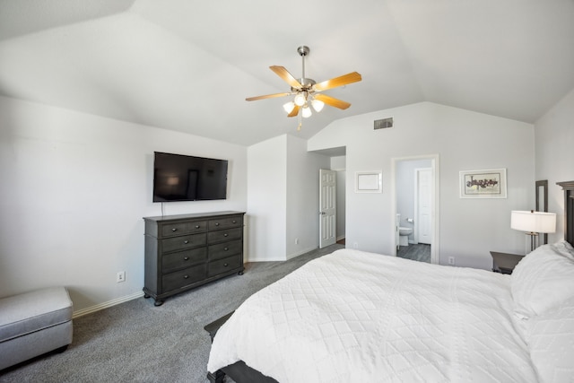 carpeted bedroom featuring vaulted ceiling, connected bathroom, and ceiling fan