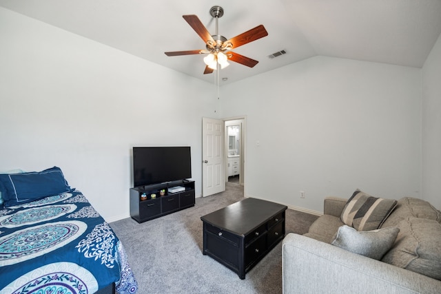 living room featuring lofted ceiling, ceiling fan, and carpet flooring