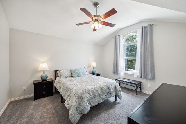 bedroom with vaulted ceiling, ceiling fan, and dark colored carpet