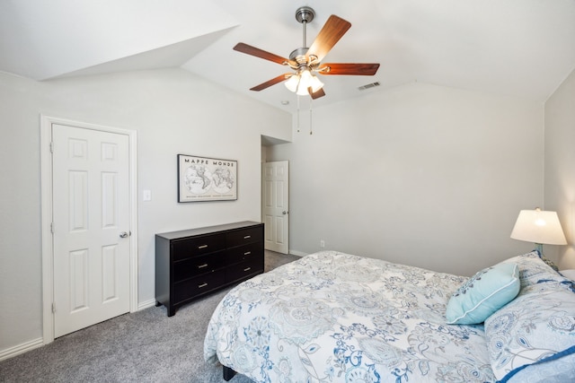 bedroom with ceiling fan, light colored carpet, and vaulted ceiling