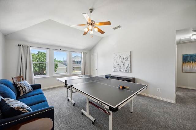 rec room with ceiling fan, lofted ceiling, and dark colored carpet