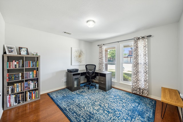 office space with hardwood / wood-style flooring and a textured ceiling