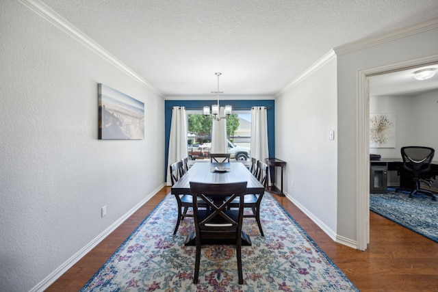 dining room featuring ornamental molding, dark hardwood / wood-style flooring, a textured ceiling, and a notable chandelier