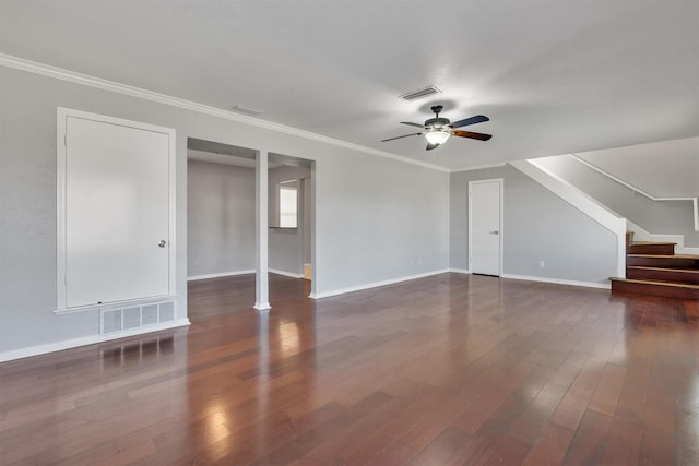 unfurnished living room featuring ornamental molding, ceiling fan, and dark hardwood / wood-style flooring