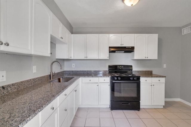 kitchen featuring white cabinetry, black range with gas cooktop, sink, and dark stone countertops