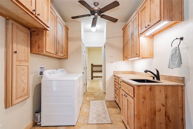 laundry room featuring washer and dryer, ceiling fan, sink, and cabinets