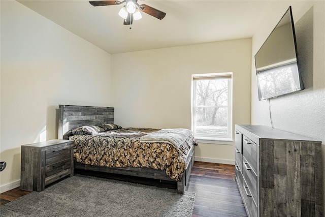 bedroom with ceiling fan and dark hardwood / wood-style flooring