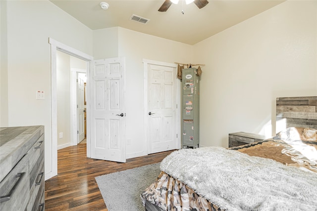 bedroom with ceiling fan, dark hardwood / wood-style floors, and a closet