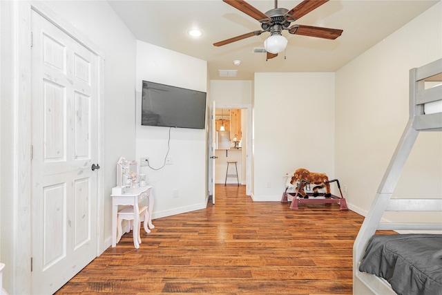 bedroom featuring hardwood / wood-style floors and ceiling fan