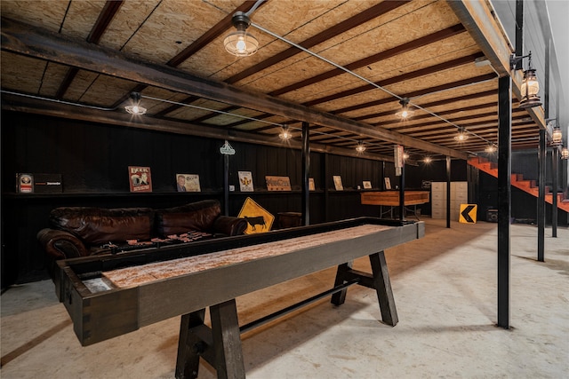 rec room featuring indoor bar and concrete floors