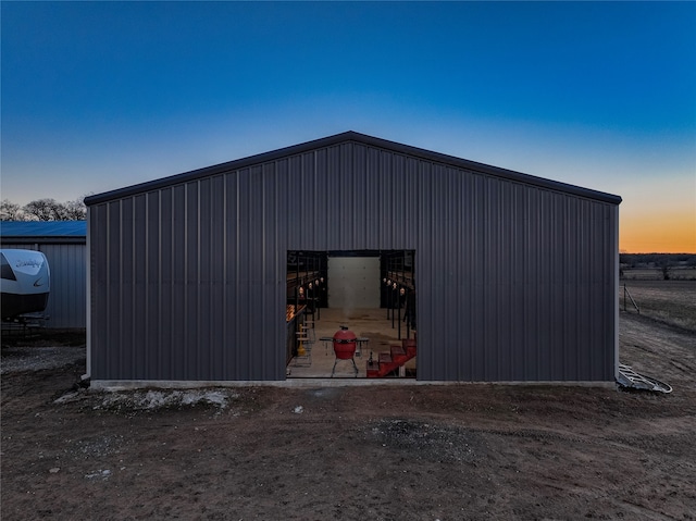 view of outdoor structure at dusk